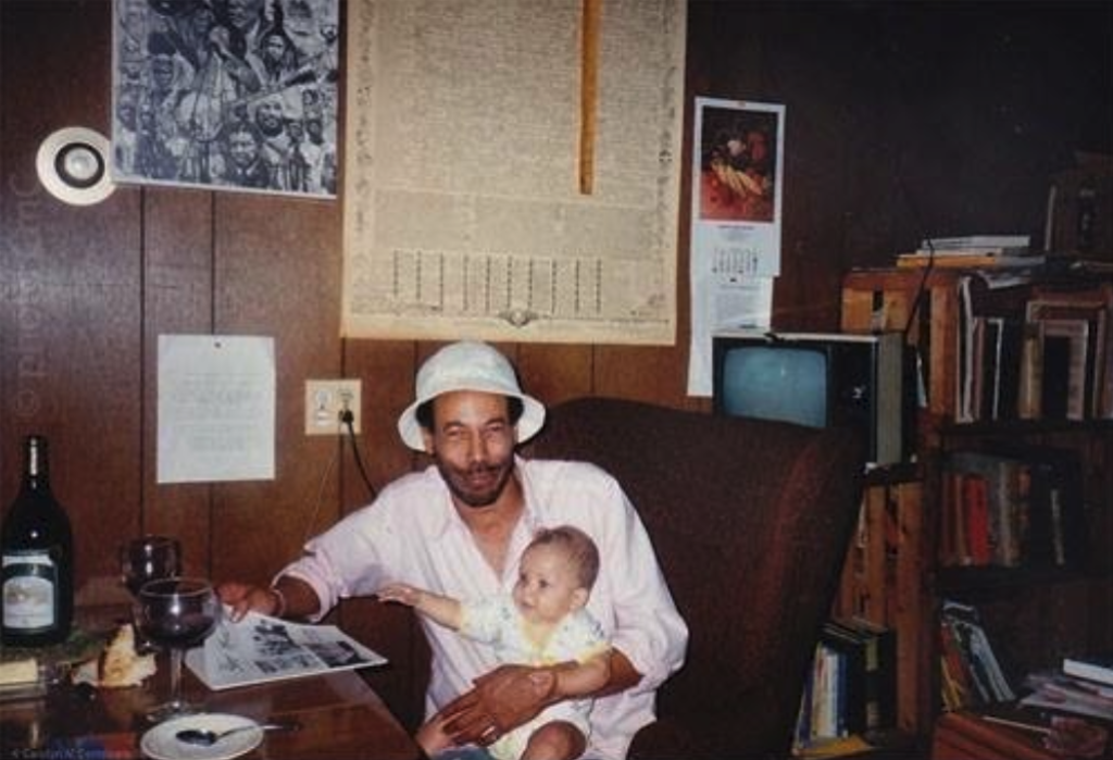 Nomi as a baby, with dad
